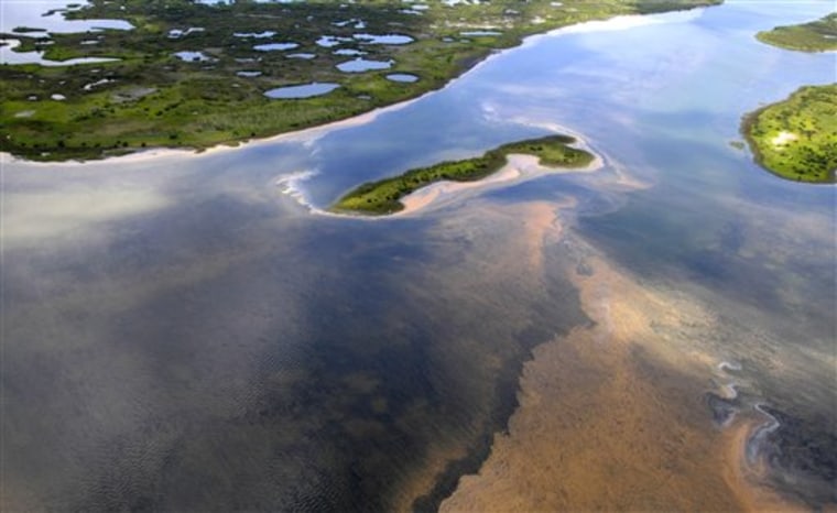 In this May 6 photo, an aerial view of the northern Chandeleur barrier islands shows sheens of oil reaching land in the Gulf of Mexico. The islands rest 20 miles from the main Louisiana coastline. 